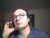 Andreas telefoniert mit dem Handy.